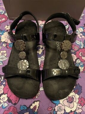 Vionic Black Patent T-Strap Sandals with Hammered Disc Accents